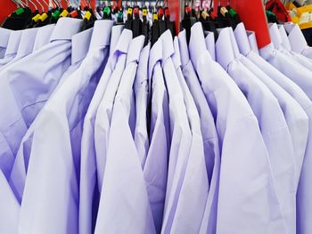 Close-up of shirts hanging for sale