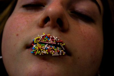 Close-up of girl with sprinkles on lips