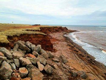 Scenic view of sea against cloudy sky