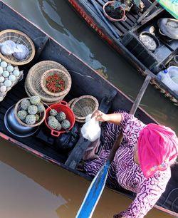 High angle view of people working in boat