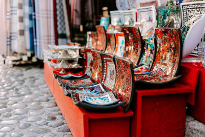 Close-up of multi coloured ceramics on table