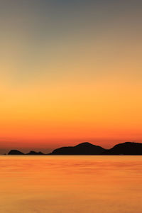 Scenic view of sea at sunset