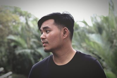 Close-up of young man looking away