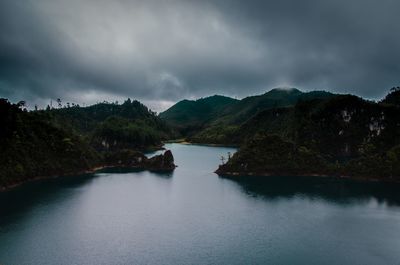 Scenic view of lake and mountains against sky