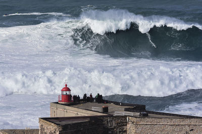 Panoramic view of sea against buildings