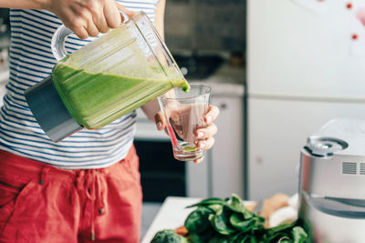 Midsection of woman preparing food