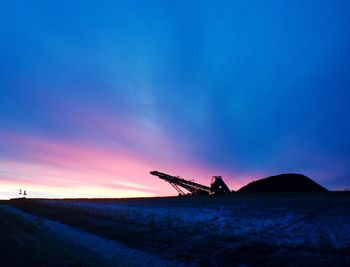 Scenic view of landscape against sky at sunset