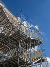 Low angle view of scaffolding on building against sky