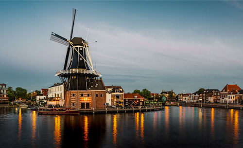 A traditional windmill in haarlem in early blue hour, the netherlands