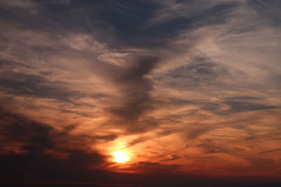 Low angle view of dramatic sky during sunset