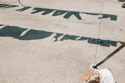 High angle view of arrow sign on street