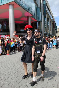 Full length portrait of friends standing on street