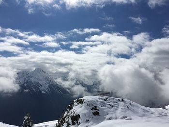 Low angle view of snowcapped mountains against sky