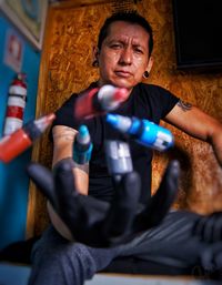 Portrait of man holding camera