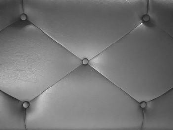 Low angle view of light bulbs hanging from ceiling