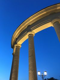 Low angle view of built structure against clear blue sky