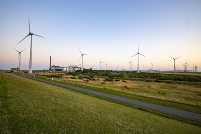 Scenic view of agricultural field against clear sky