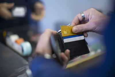 Man holding wallet with cards