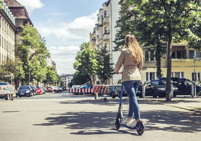 Full length of woman on street in city