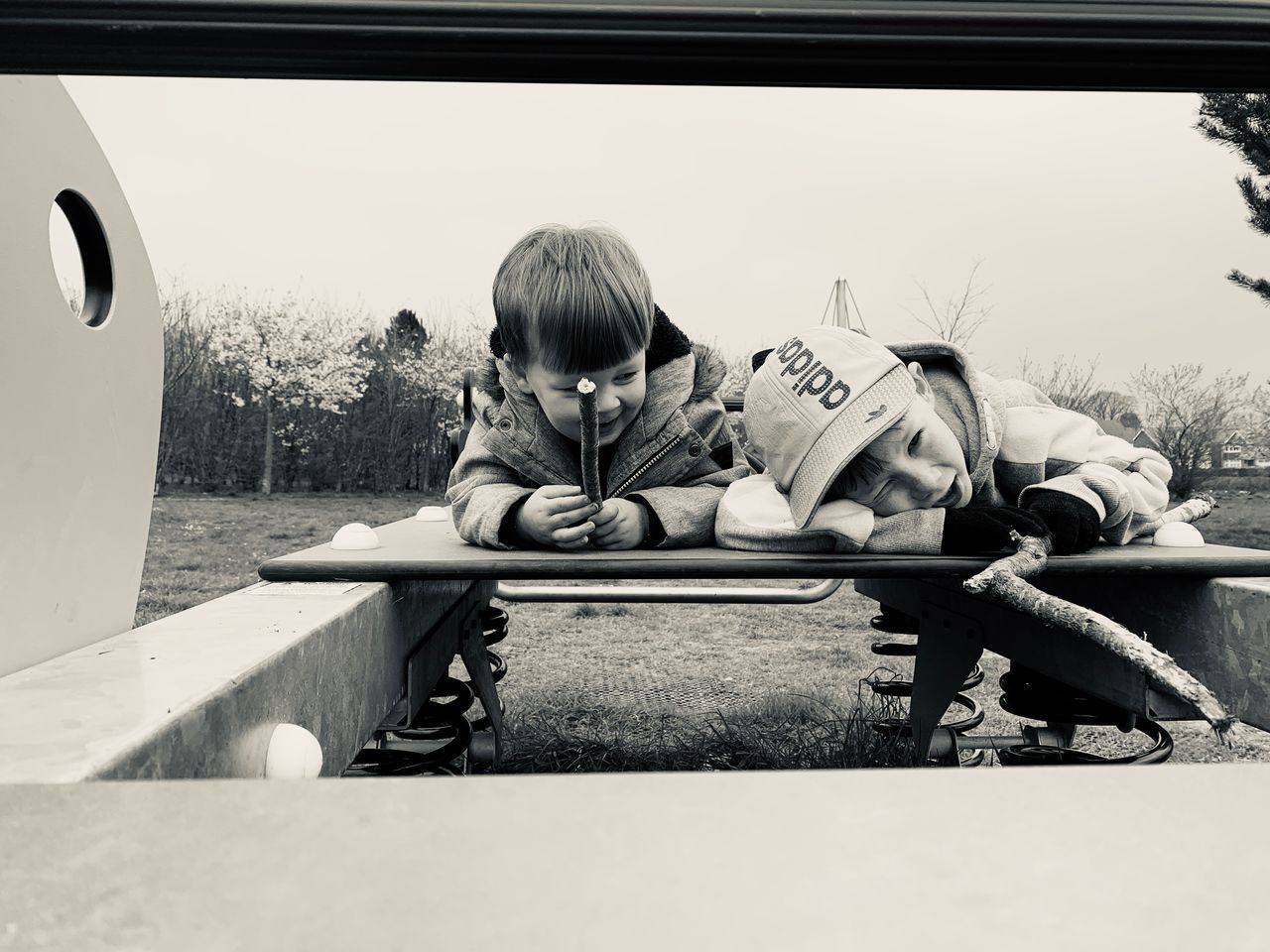 FULL LENGTH PORTRAIT OF BOY SITTING ON SEAT