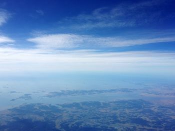 View of calm sea against clouds