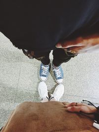 Low section of woman on sand