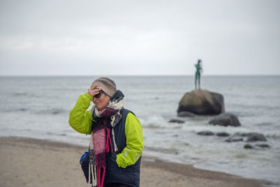 Full length of man photographing sea
