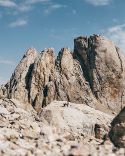 Rock formation on land against sky