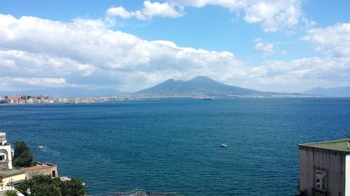 Scenic view of gulf of naples against cloudy sky