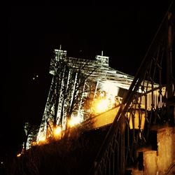 Low angle view of illuminated building at night