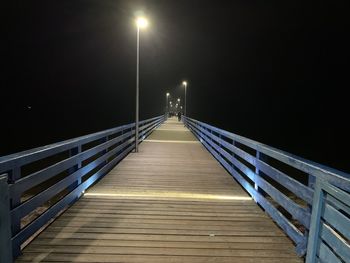 Empty footbridge at night