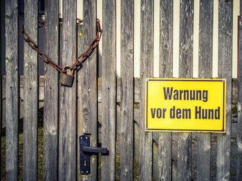 Close-up of sign on wooden door