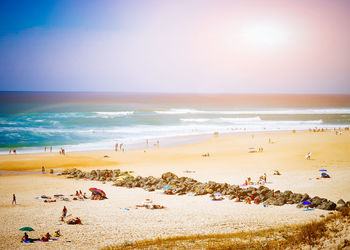 Scenic view of beach on sunny day