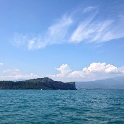 Scenic view of sea against cloudy sky