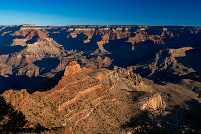 Scenic view of rocky mountains against clear sky