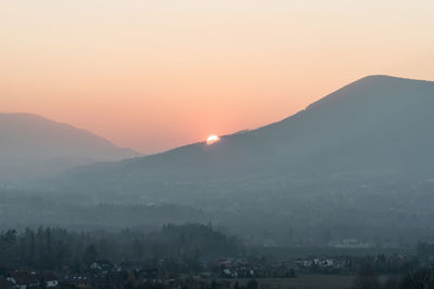 Scenic view of mountains against sky during sunset