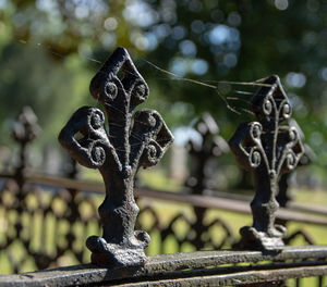 Close-up of railing on sunny day