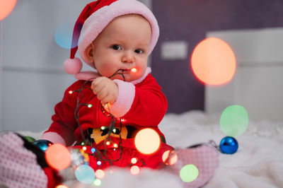 Close-up of cute girl playing with toy at home