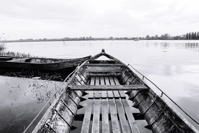 Pier on lake against sky