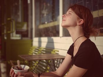 Portrait of young woman looking away