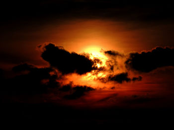 Scenic view of dramatic sky at sunset