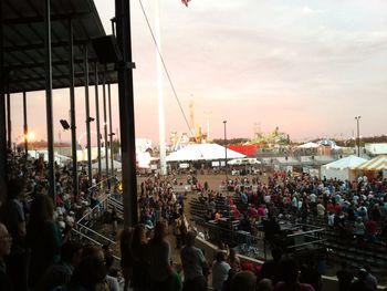 Crowd at town square during sunset