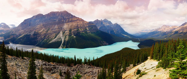 Scenic view of mountains against cloudy sky