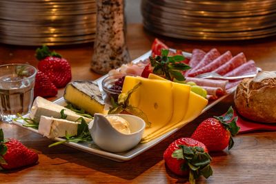 Various fruits in bowl on table