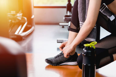 Midsection of woman exercising in gym