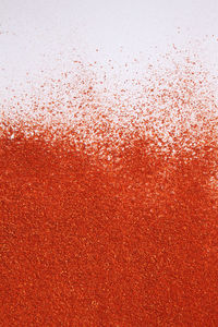 Full frame shot of chili powder on white background