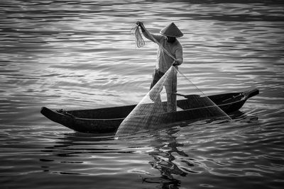Boy in boat on sea