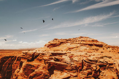 Scenic view of desert against sky during sunset