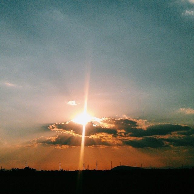 sunset, sun, silhouette, sky, tranquil scene, scenics, tranquility, beauty in nature, sunbeam, sunlight, nature, idyllic, landscape, orange color, cloud - sky, lens flare, cloud, outdoors, no people, back lit