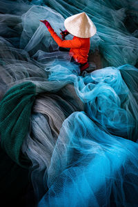 High angle view of fishing net on boat